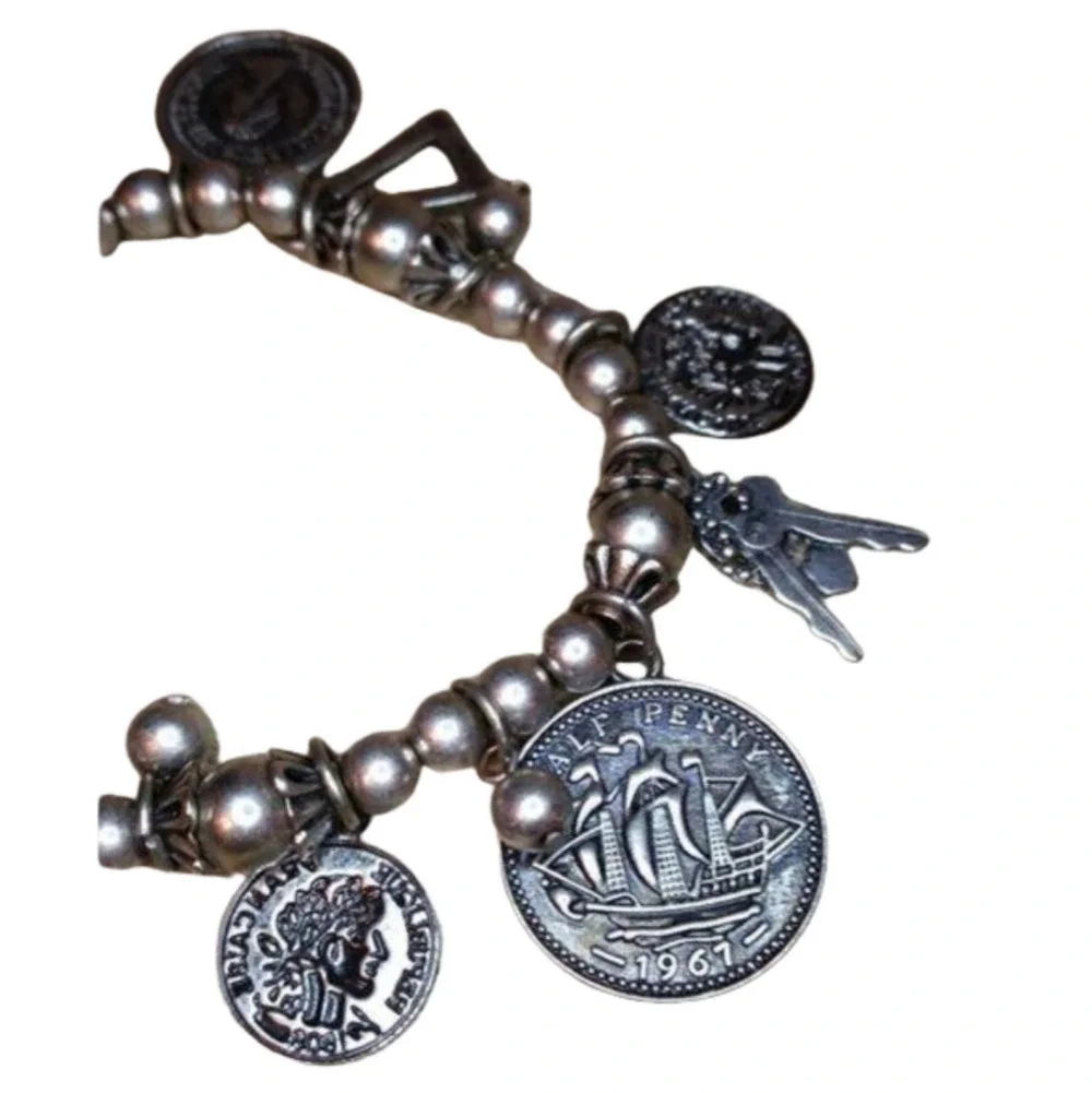 𝅺Vintage roll on dangle charm bracelet with coins and keys antique silver tone.